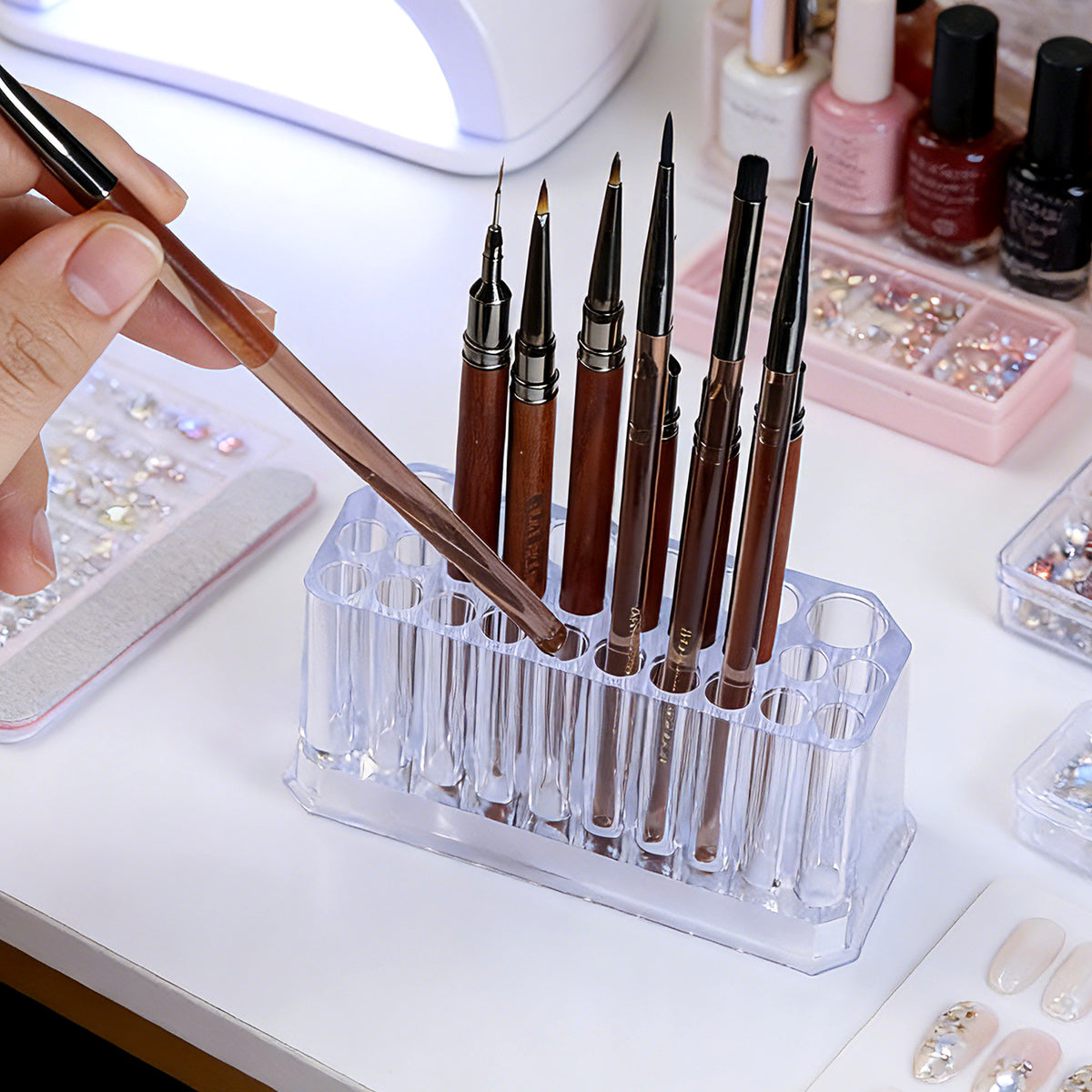 Clear acrylic stepped brush holder with brushes arranged tall to short on vanity