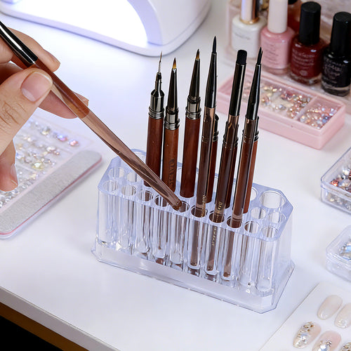 Clear acrylic stepped brush holder with brushes arranged tall to short on vanity